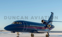 Falcon 900 Exterior with navy paint and light blue and magenta stripe