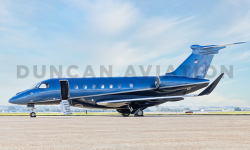 Exterior of a newly painted Embraer EMB500 in bright blue and navy