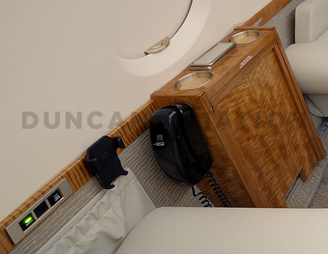 Hawker 800 interior with refurbished siderail including cup holders by Duncan Aviation