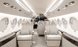 Interior of newly refurbished Falcon 7X in shades of cream by Duncan Aviation