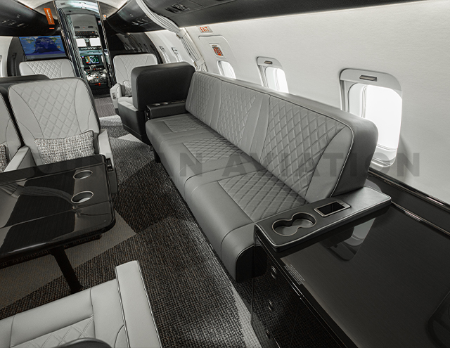 Gray leather divan in Challenger 604