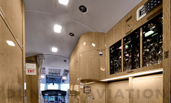 Galley in light wood tones of refurbished Falcon 900