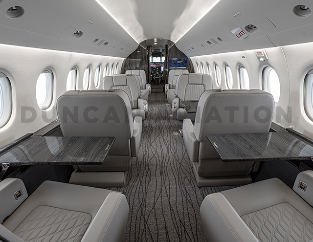 Eight club seats with six tables in Falcon 2000 interior refurbishment