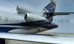 Close up of tail of Falcon 900 with new pain by Duncan Aviation showing light gray main body with slate blue curves