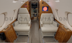 Hawker 800 with refurbished interior by Duncan Aviation with light beige seats and honey wood tones