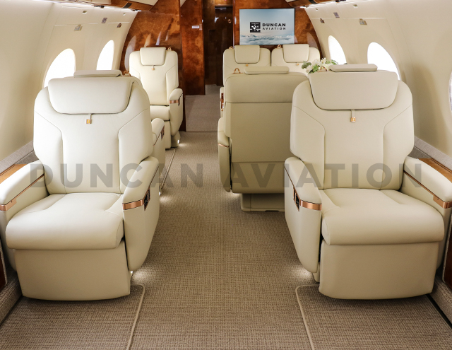 Interior of Gulfstream 650 with cream leather captain chairs