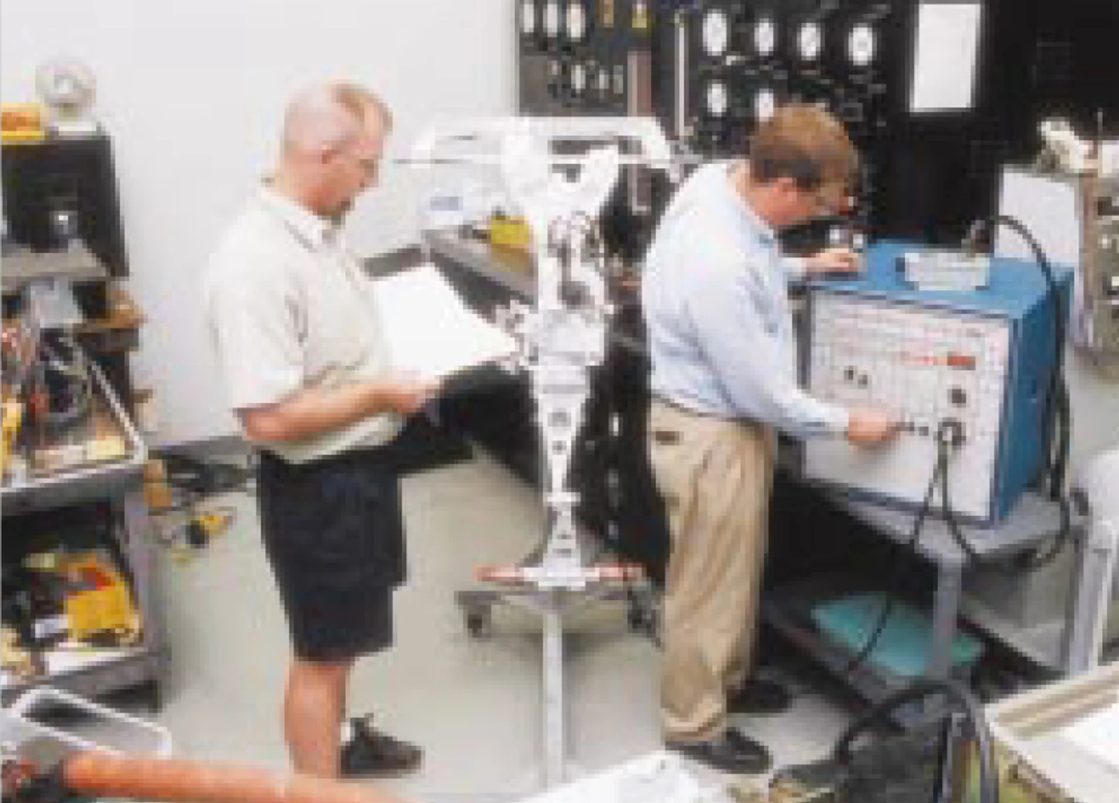 Prop/Accessory Team Leader Vince Cruickshank and R&D Tech Chris Hoagg adjust and test a Challenger&rsquo;s nose gear steering system in 1998. Duncan Aviation Accessories shops offer faster turn-times for accessory repairs and overhauls.